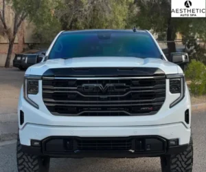 highlighting its clean grille and dark tinted front windshield, as shown in window tint