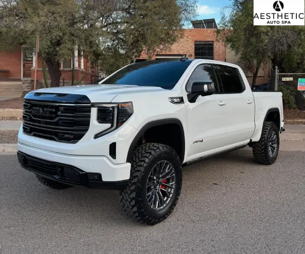 highlighting its clean grille and dark tinted front windshield, as shown in window tint